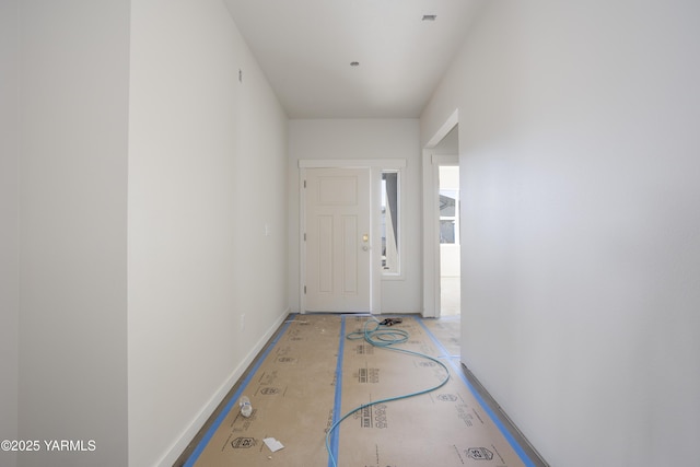 entryway featuring baseboards