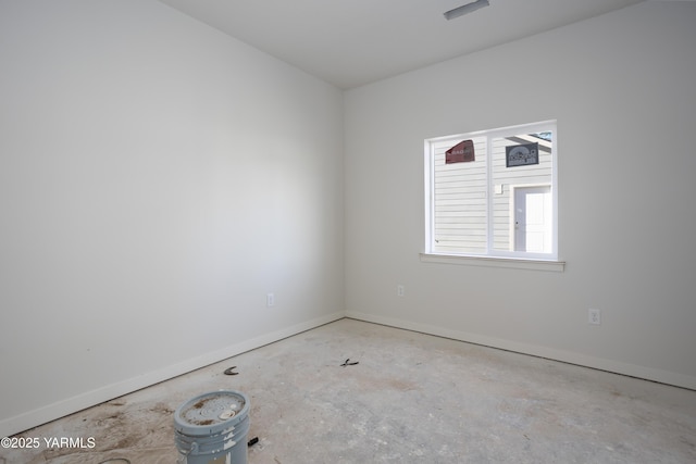 spare room featuring baseboards