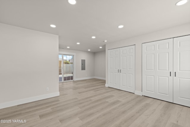 5804 W Walnut St, Yakima, WA 98908 - unfurnished living room with electric panel, recessed lighting, and light wood-type flooring