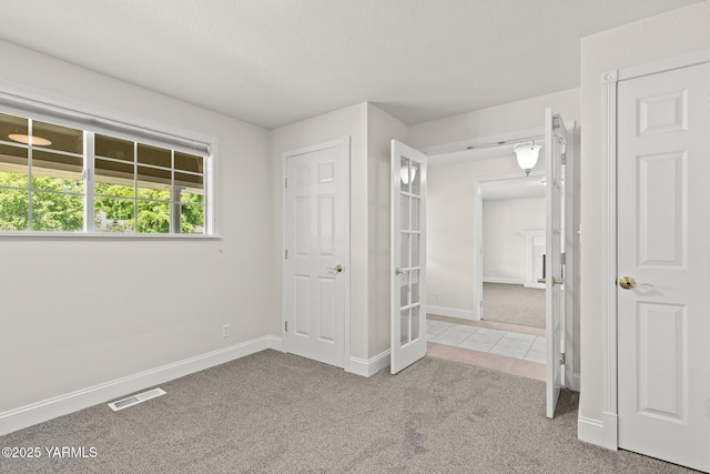 5804 W Walnut St, Yakima, WA 98908 - unfurnished bedroom with light carpet and light tile patterned flooring
