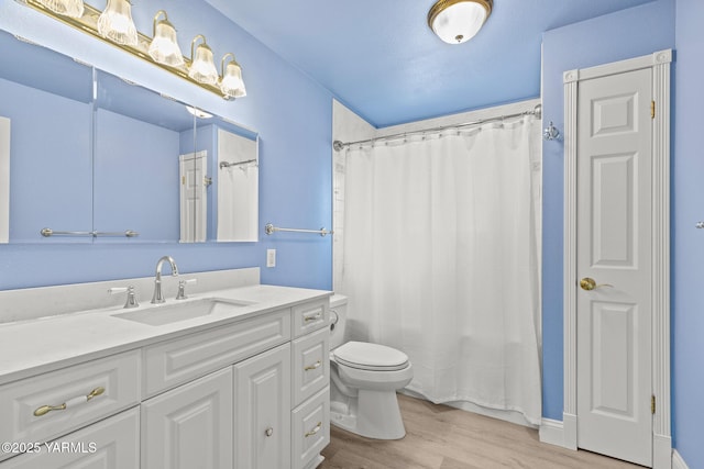 5804 W Walnut St, Yakima, WA 98908 - full bathroom featuring wood finished floors, vanity, and a shower with shower curtain