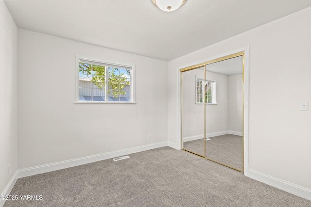 5804 W Walnut St, Yakima, WA 98908 - unfurnished bedroom featuring carpet, multiple windows, and a closet