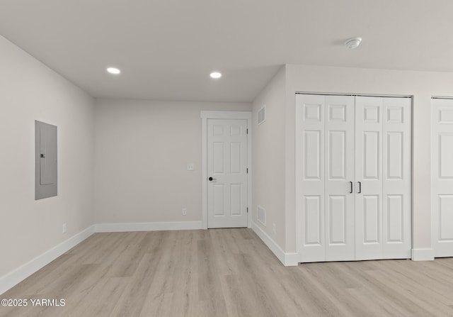 5804 W Walnut St, Yakima, WA 98908 - unfurnished bedroom with electric panel, light wood-style floors, and recessed lighting