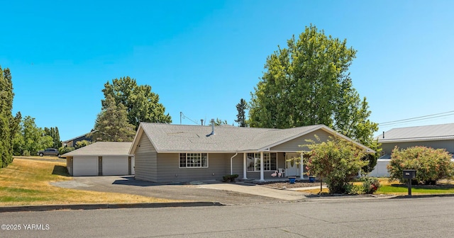 5804 W Walnut St, Yakima, WA 98908 - ranch-style house with a garage, a porch, and roof with shingles