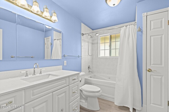 5804 W Walnut St, Yakima, WA 98908 - full bathroom with vanity, shower / tub combo with curtain, and wood finished floors