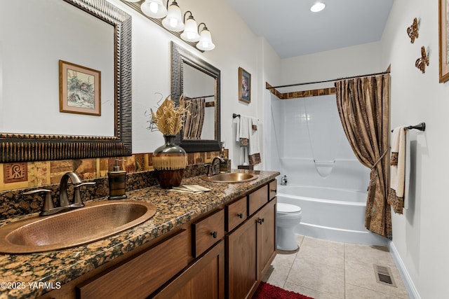 full bathroom featuring tile patterned flooring, shower / bath combo, visible vents, and a sink