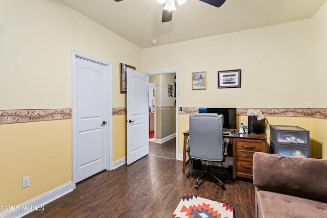 office area with baseboards, a ceiling fan, and dark wood-style flooring