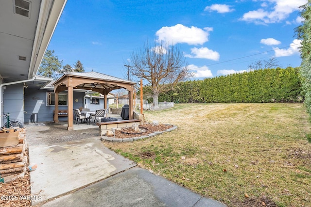 view of yard featuring a gazebo and a patio area