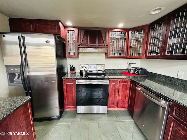 1465 Cook Rd, Yakima, WA 98908 - kitchen featuring reddish brown cabinets, stainless steel appliances, custom exhaust hood, and recessed lighting