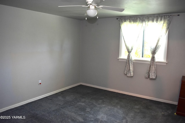 empty room with baseboards, ceiling fan, and dark colored carpet