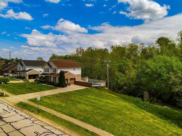 view of front facade featuring a front yard and a garage