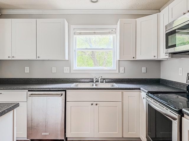 kitchen featuring white cabinets, sink, and stainless steel appliances