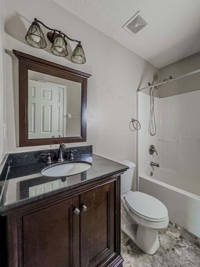 full bathroom with tile floors, shower / tub combination, toilet, and vanity with extensive cabinet space