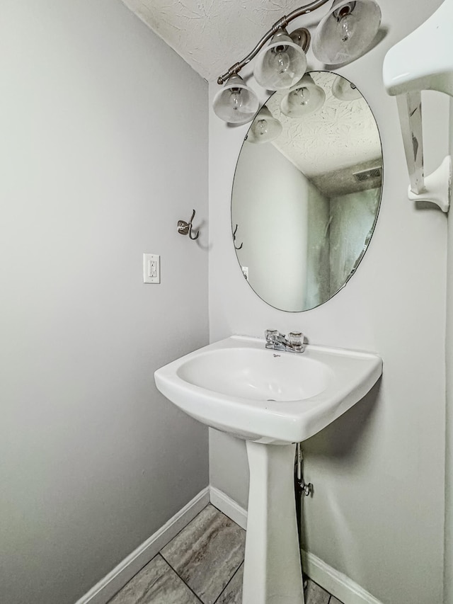 bathroom featuring sink and tile flooring