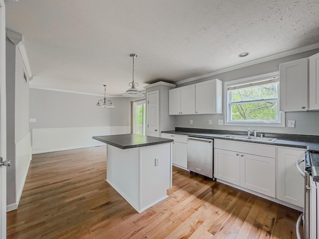 kitchen with wood-type flooring, sink, stove, and stainless steel dishwasher