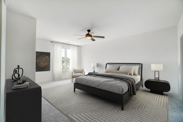 bedroom with ceiling fan and light colored carpet