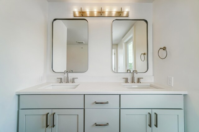 bathroom featuring dual vanity