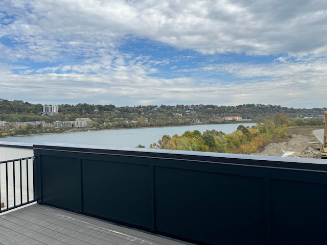 wooden terrace with a water view