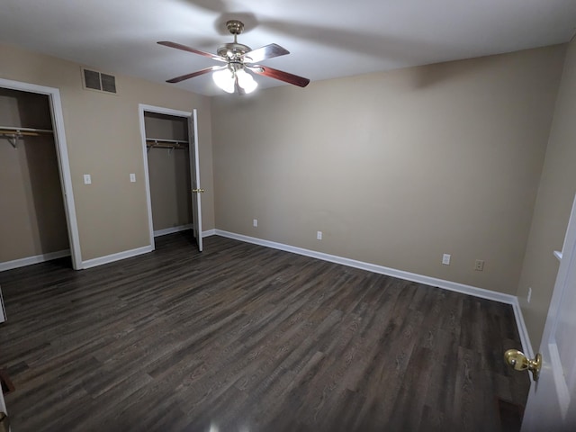 unfurnished bedroom with dark hardwood / wood-style floors and ceiling fan