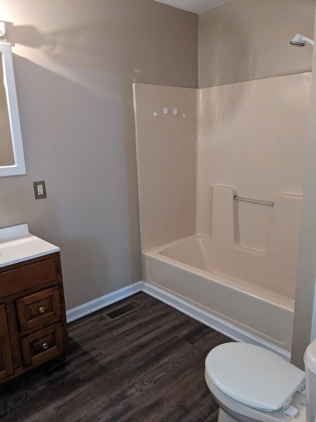 full bathroom featuring vanity, shower / bathtub combination, toilet, and hardwood / wood-style flooring