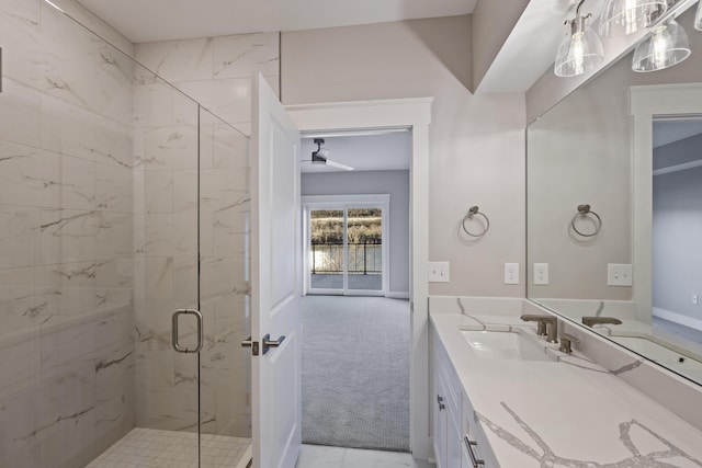 bathroom featuring walk in shower and vanity