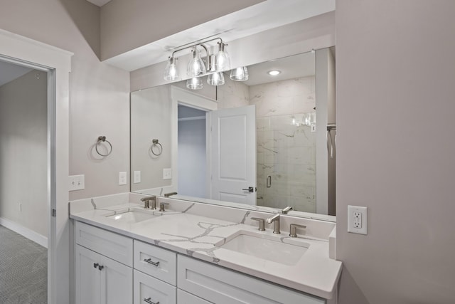 bathroom with walk in shower and vanity