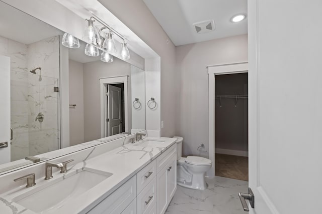 bathroom featuring toilet, walk in shower, and vanity