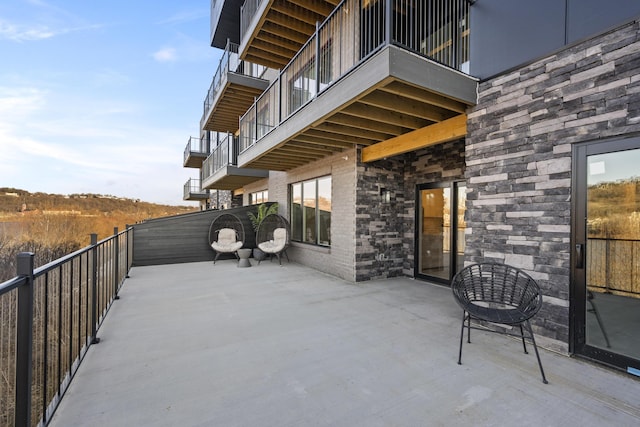 view of patio with a balcony