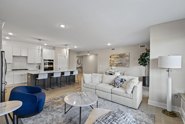 living room featuring light hardwood / wood-style flooring