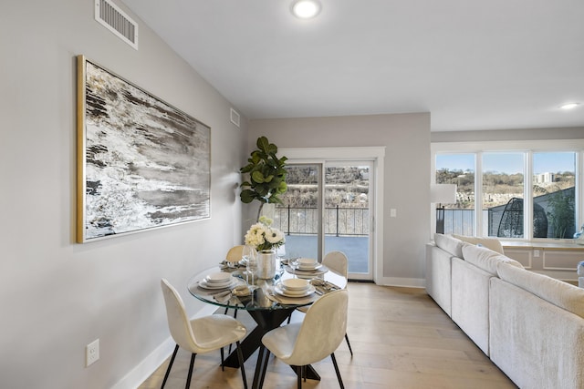 dining area with light wood-type flooring