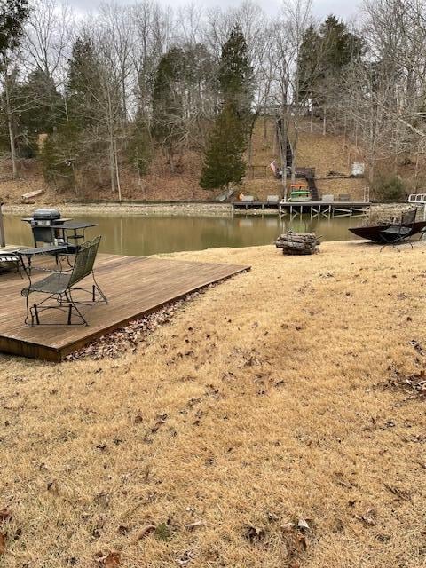 exterior space with a deck with water view