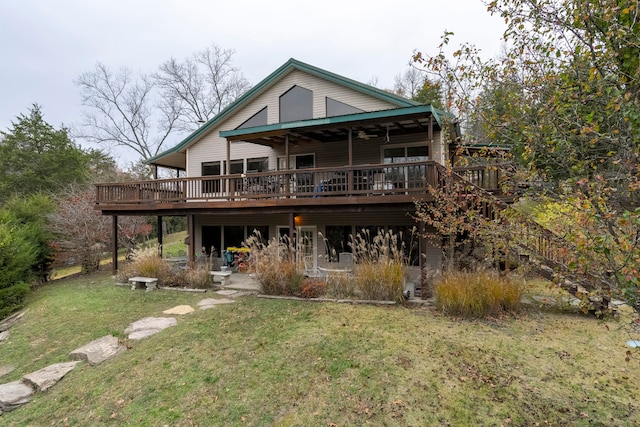 back of house with a yard and a deck