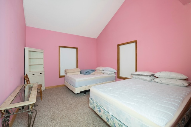 carpeted bedroom featuring high vaulted ceiling