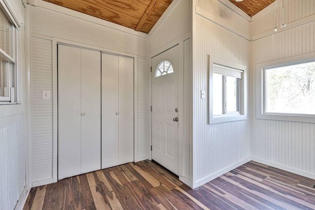 entrance foyer with dark hardwood / wood-style flooring, vaulted ceiling, wood ceiling, and a wealth of natural light