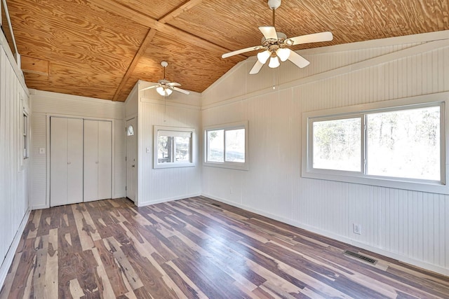 spare room featuring lofted ceiling, wooden ceiling, ceiling fan, and dark hardwood / wood-style floors