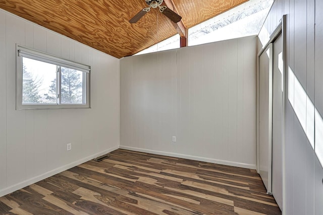 empty room with lofted ceiling with beams, dark hardwood / wood-style floors, wood ceiling, and ceiling fan