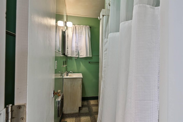 bathroom featuring vanity, tile floors, a chandelier, and ornamental molding