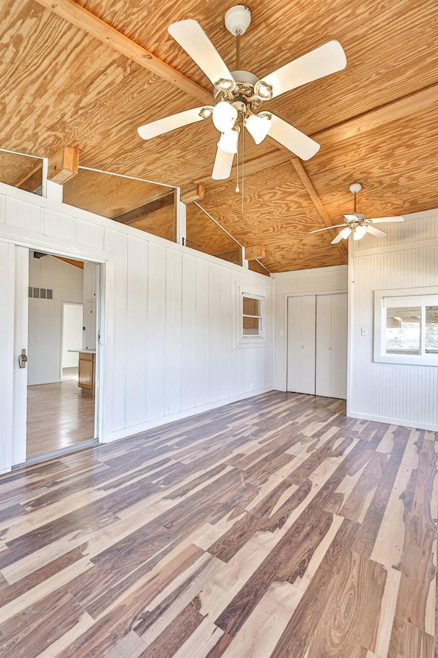 garage featuring wooden ceiling and ceiling fan