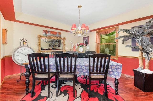 8104 Harms Hill Dr, Florence, KY 41042 - dining space with wood finished floors, a chandelier, and baseboards