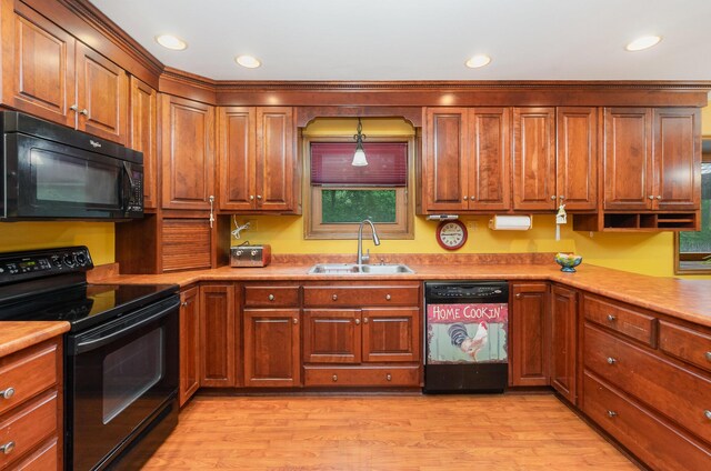 8104 Harms Hill Dr, Florence, KY 41042 - kitchen with black appliances, a sink, light wood finished floors, recessed lighting, and brown cabinets