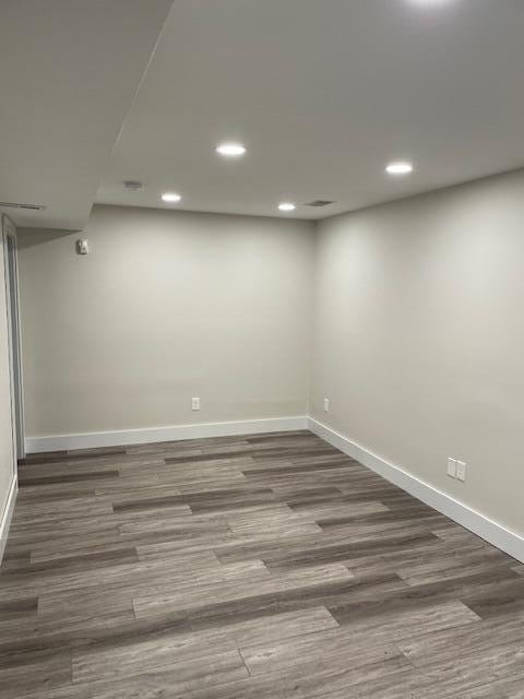 spare room featuring hardwood / wood-style flooring