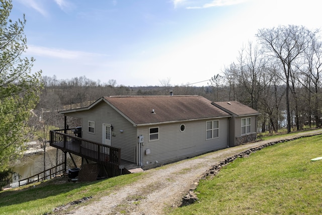 view of side of property with a yard