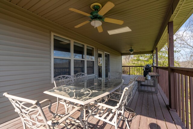 wooden terrace featuring ceiling fan