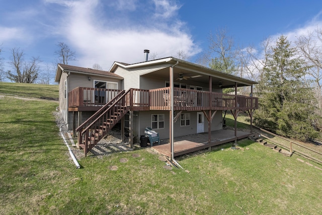 rear view of property with a wooden deck and a yard