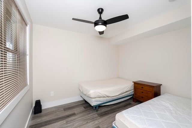 bedroom featuring ceiling fan and dark hardwood / wood-style floors