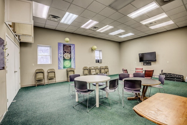 game room with a drop ceiling and carpet floors