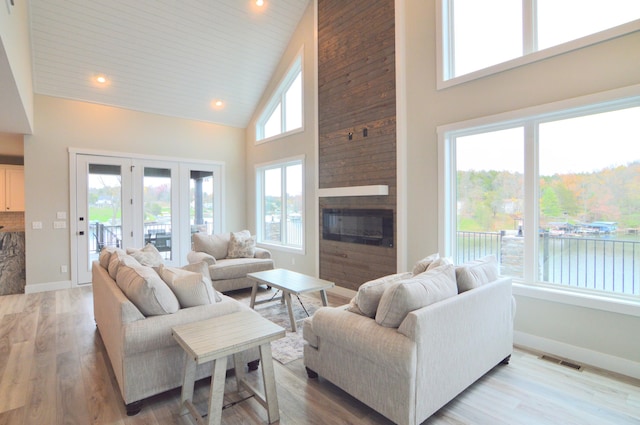 465 Cedar Hill Dr, Williamstown, KY 41097 - living room with a high ceiling, a water view, baseboards, a large fireplace, and recessed lighting