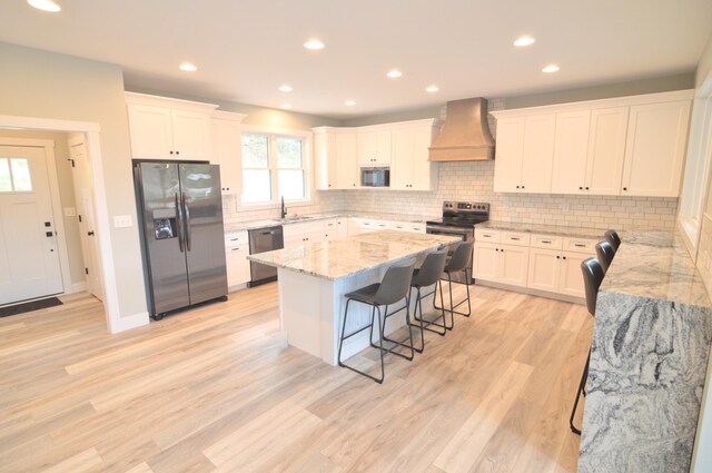 465 Cedar Hill Dr, Williamstown, KY 41097 - kitchen with stainless steel appliances, custom exhaust hood, a sink, a breakfast bar, and a kitchen island