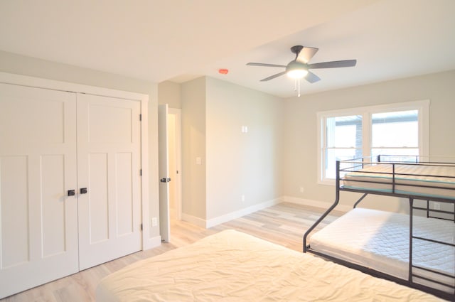 465 Cedar Hill Dr, Williamstown, KY 41097 - bedroom with light wood-style flooring, baseboards, a closet, and a ceiling fan