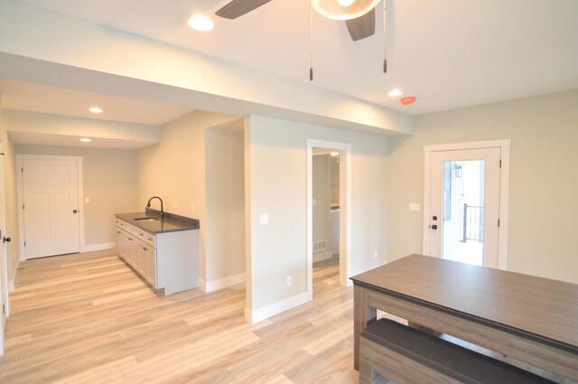 465 Cedar Hill Dr, Williamstown, KY 41097 - kitchen featuring light wood-type flooring, dark countertops, baseboards, a sink, and recessed lighting